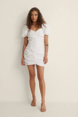 THE GATHERED RUSHED MINI ORGANIC COTTON DRESS - WHITE - EXCLUSIVE Dresses from NA-KD - Just €49! SHOP NOW AT IAMINHATELOVE BOTH IN STORE FOR CYPRUS AND ONLINE WORLDWIDE @ IAMINHATELOVE.COM