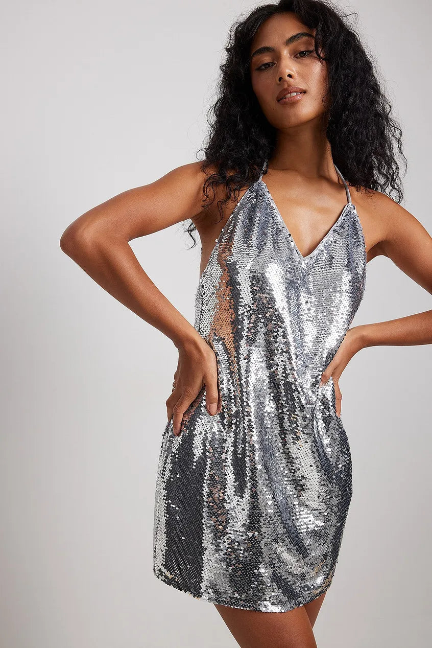 THE ULTIMATE Y2K OPEN BACK SEQUIN MINI DRESS IN SILVER - EXCLUSIVE Dresses from NA-KD - Just €71! SHOP NOW AT IAMINHATELOVE BOTH IN STORE FOR CYPRUS AND ONLINE WORLDWIDE @ IAMINHATELOVE.COM