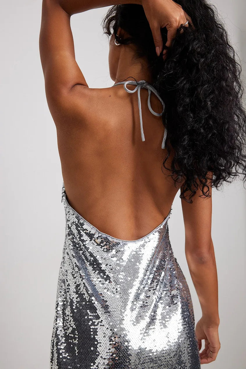 THE ULTIMATE Y2K OPEN BACK SEQUIN MINI DRESS IN SILVER - EXCLUSIVE Dresses from NA-KD - Just €71! SHOP NOW AT IAMINHATELOVE BOTH IN STORE FOR CYPRUS AND ONLINE WORLDWIDE @ IAMINHATELOVE.COM